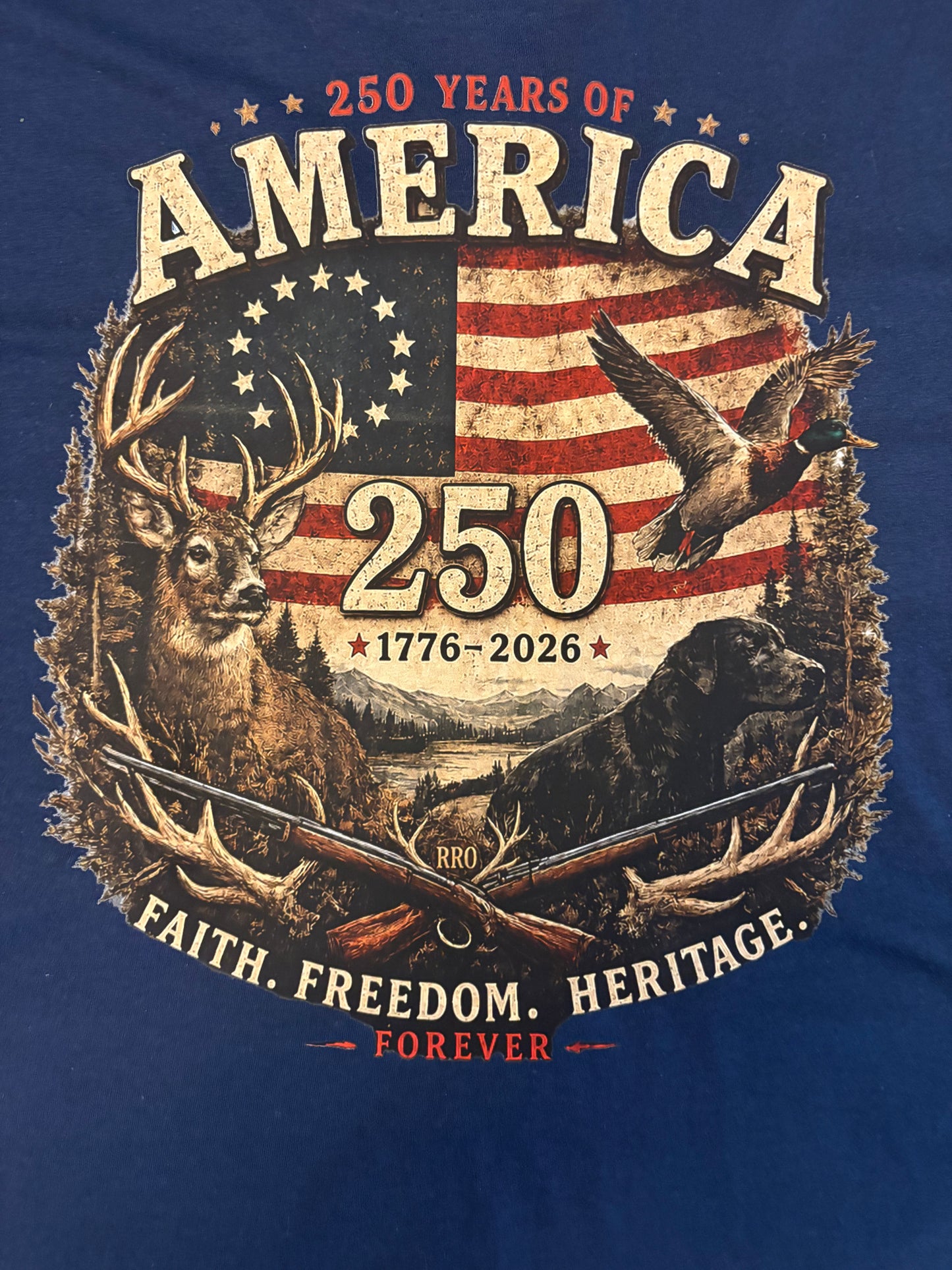T-shirt design celebrating 250 years of America with hunting-themed graphics on a blue background.